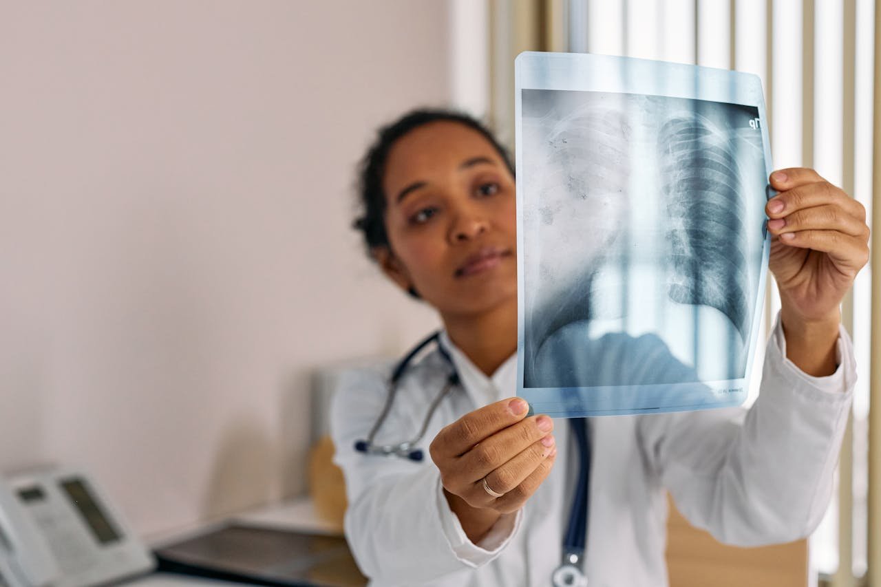 Dr. performing X-ray examination