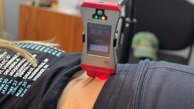 Erchonia Cold Laser therapy being used to treat a patient at Path to Wellness Clinic of Chiropractic in Fleming Island, FL, for pain relief and healing.