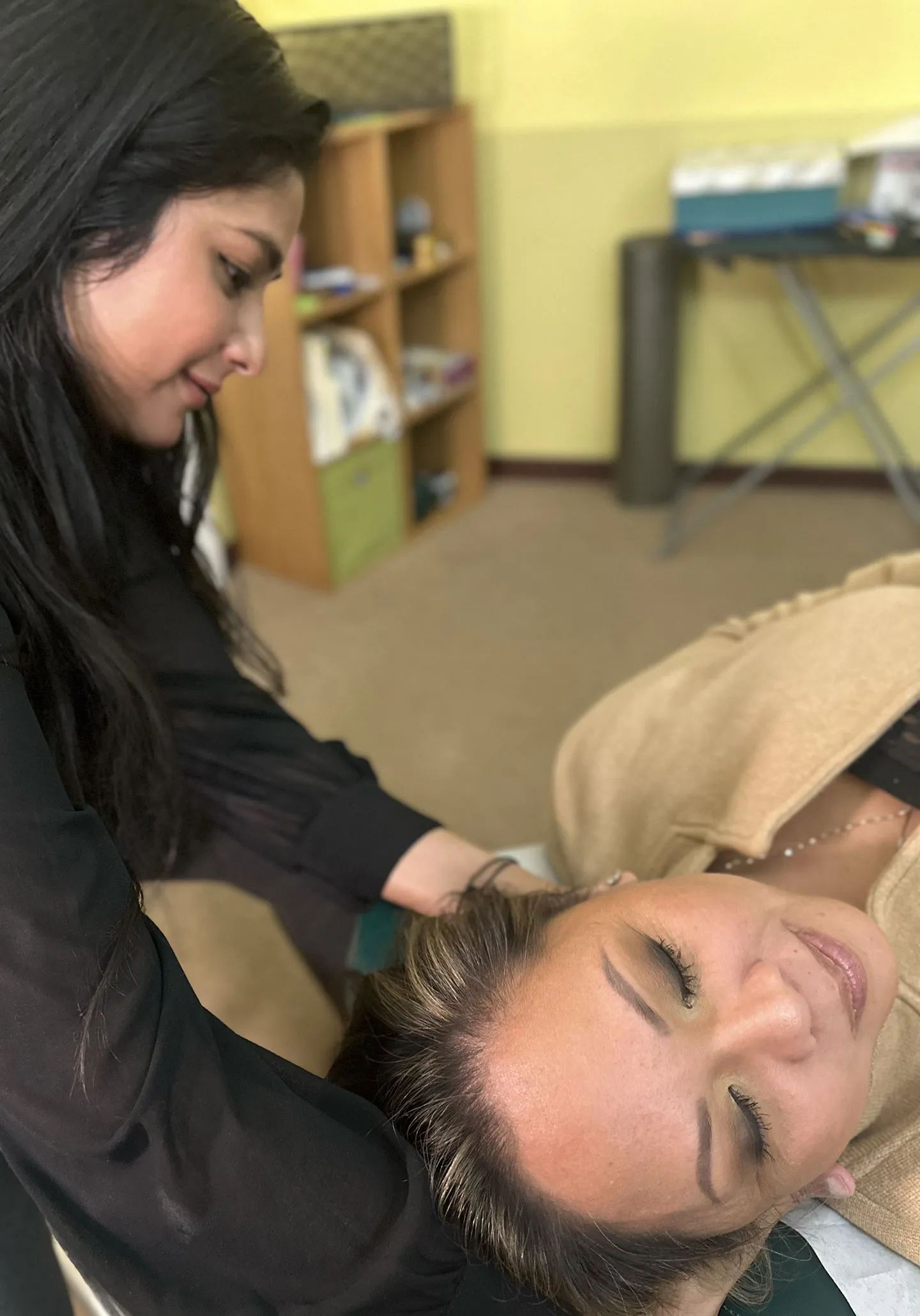 Dr. Chitra treating neck pain at Path to Wellness Clinic of Chiropractic